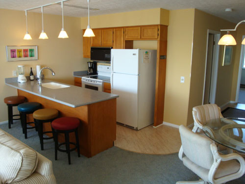 The fully equipped kitchen offers a breakfast bar for casual dining.
